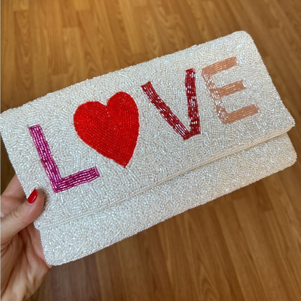 Brand new beaded clutch with LOVE in colorful beaded colors.